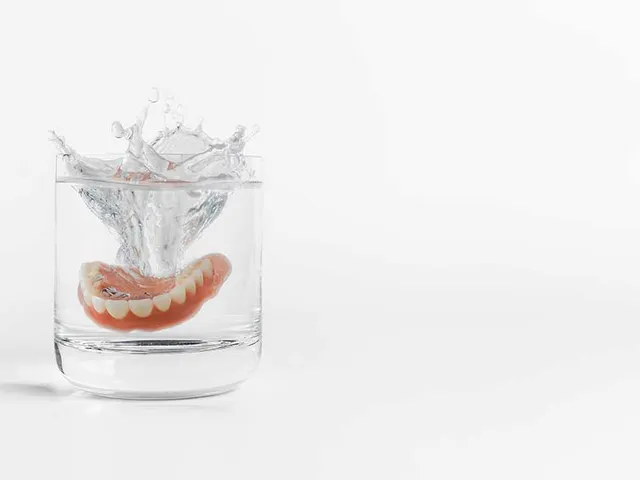 A denture in a glass of water