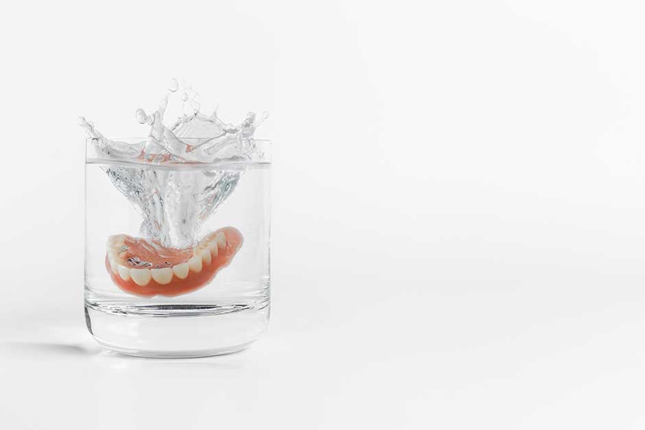 Dentures in a glass of water.